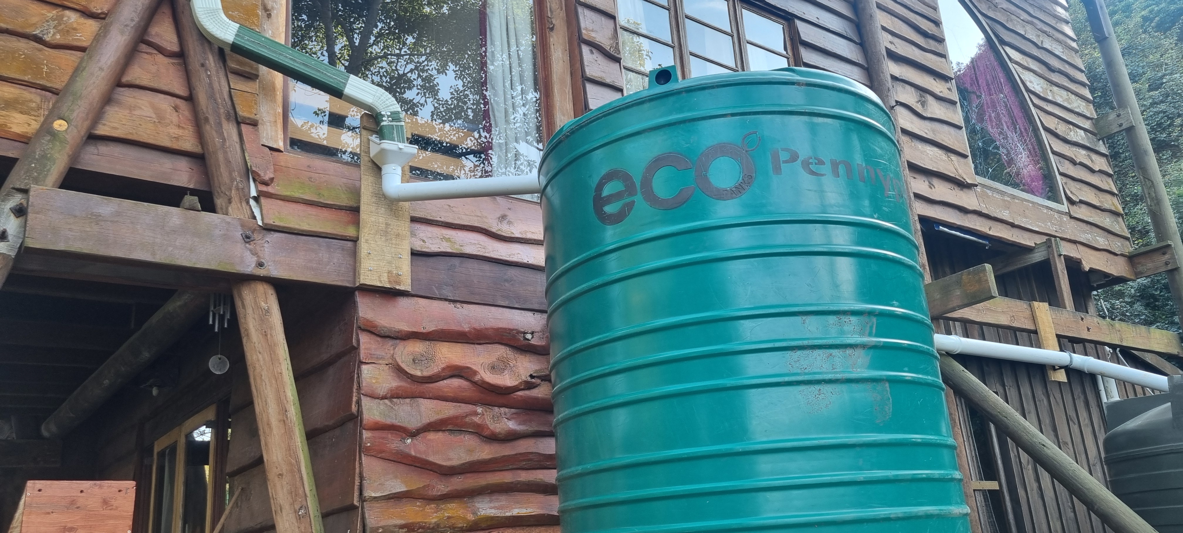 Roof gutters feed straight into the first settling tank, where sediment and debris drop out before the water moves on.