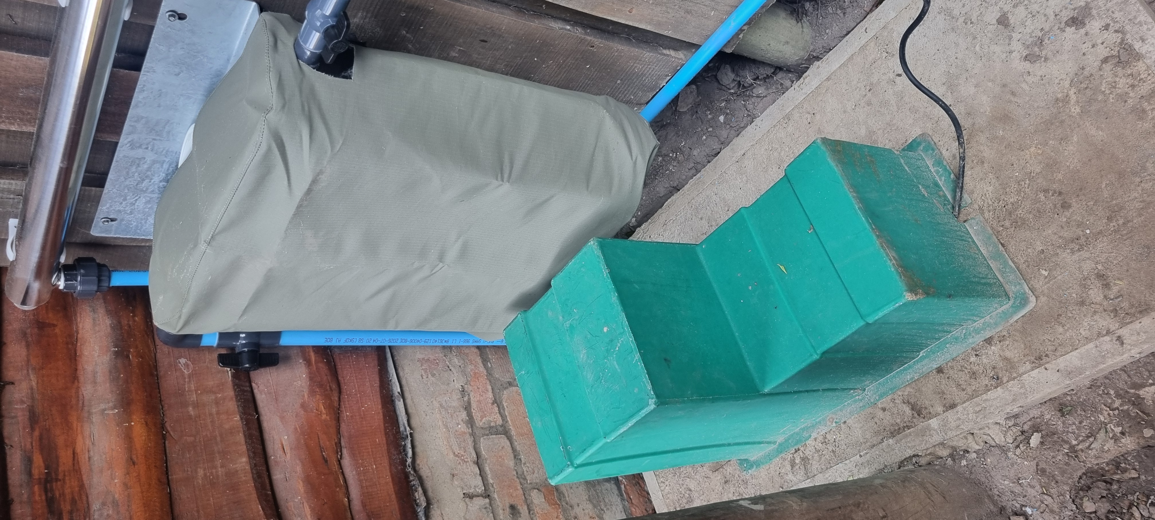 A magnetic pump and filter housing treat the stored water before it's distributed to the property.